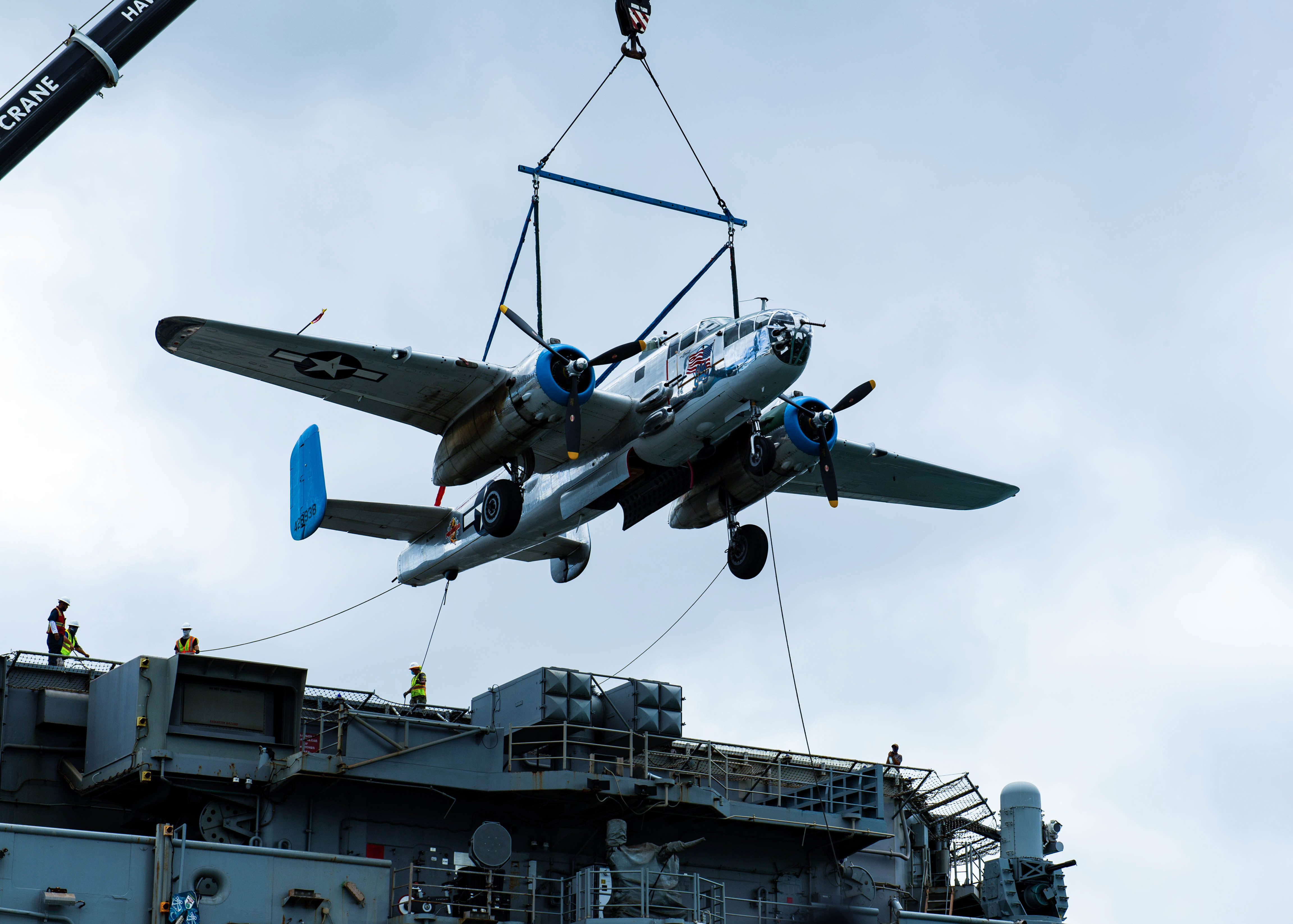 A B-25 is offloaded from the USS Essex. (Jessica Blackwell/U.S. Navy)