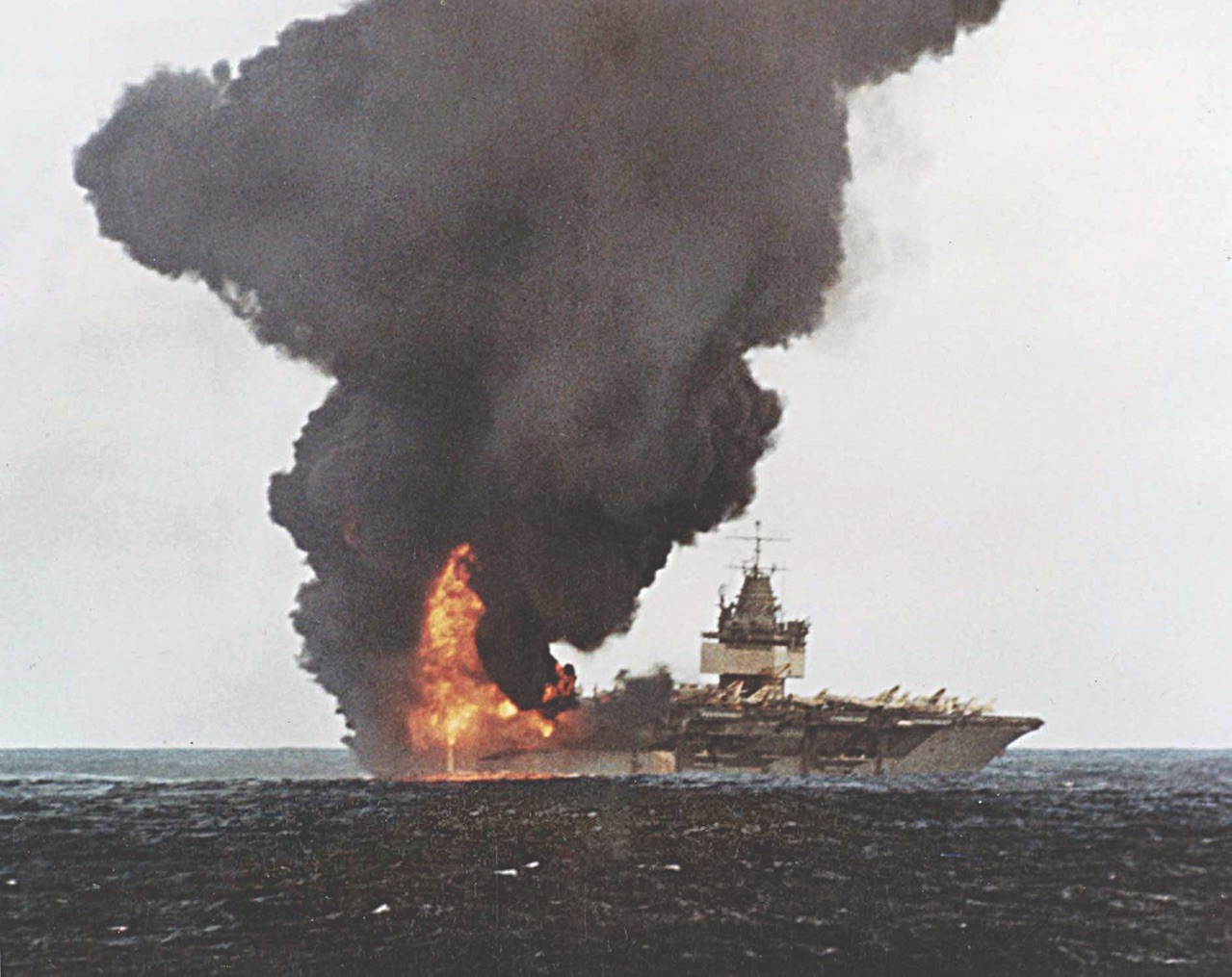 Smoke rises from the Enterprise on Jan. 14, 1969, following an accidental explosion. / US Navy