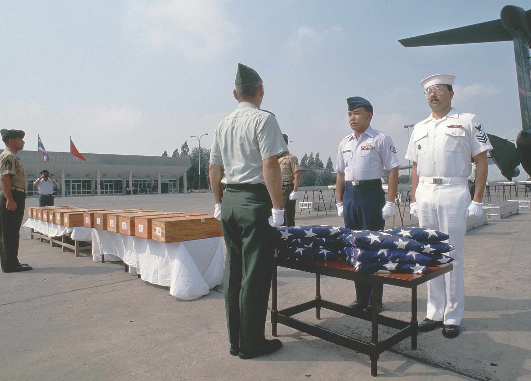 The remains of Americans killed in Vietnam are honored before being loaded onto a C-141 in Hanoi in February 1994. / Getty Images