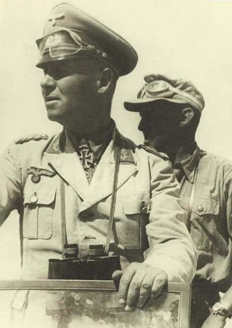 Rommel in Africa. On the last day of his life, he met Nazi officials wearing his Afrika Korps tunic.