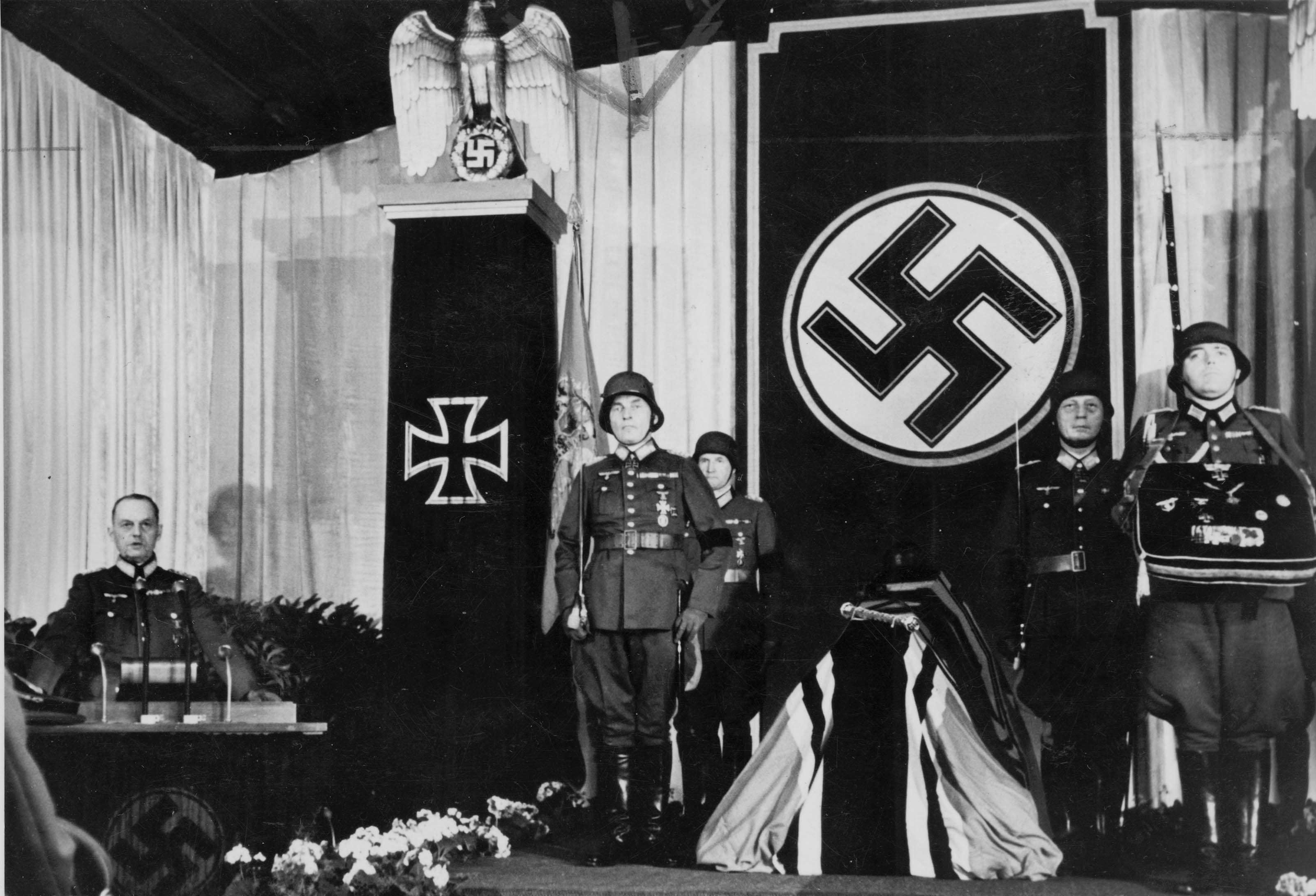 Field Marshal Gerd von Rundstedt (left) delivers a promotional speech for Hitler as Rommel's eulogy at his funeral in 1944. Photo courtesy of Haus der Geschichte Baden-Württemberg