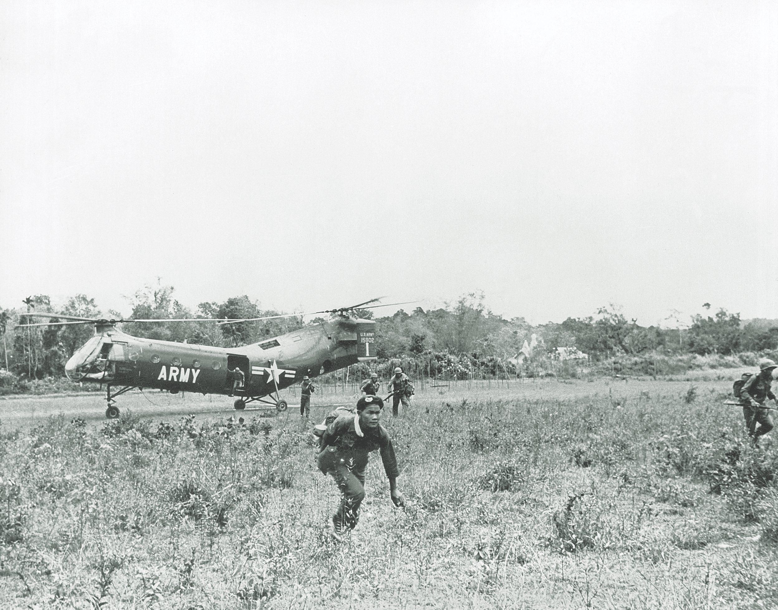 South Vietnamese soldiers move out from a landing zone in search of Viet Cong 1962 / Getty Images