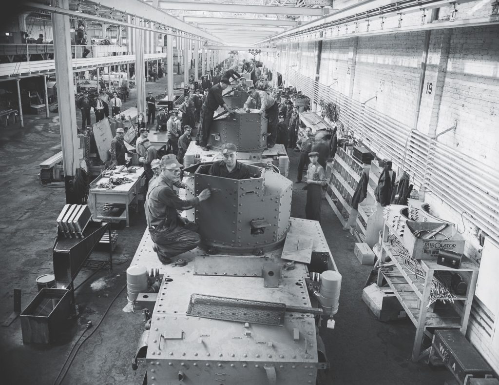 An assembly line of M3 tanks gets their turrets. (Australian War Memorial 9114)