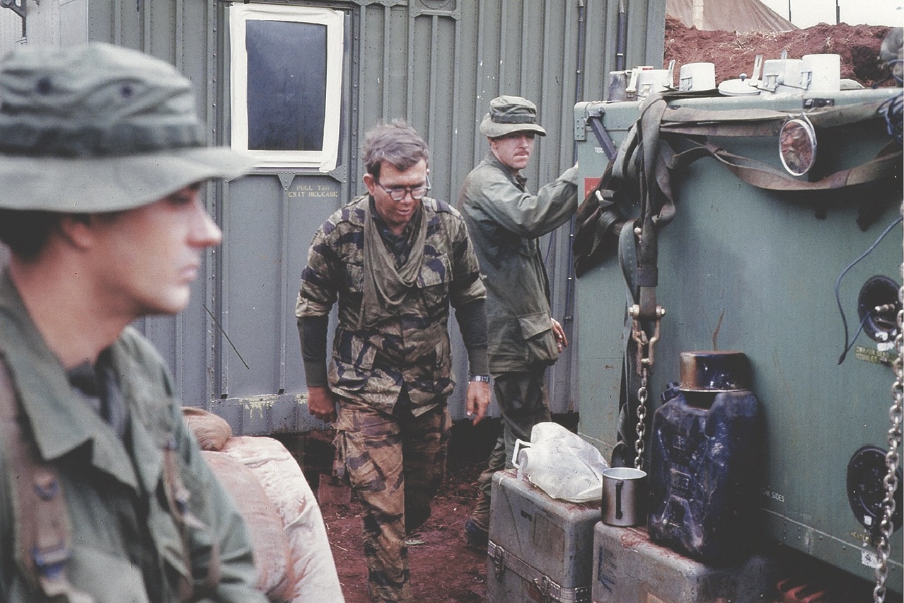 Keith (center) and Bonnot (left) outside their trailer at the Khe Sanh communications center.