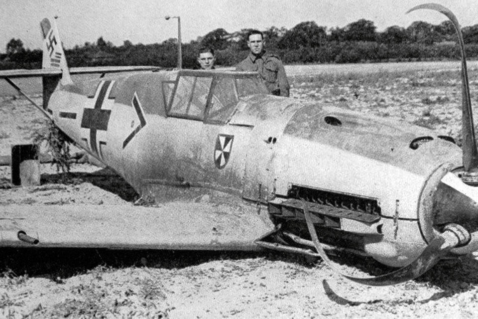 On September 5, 1940, two British soldiers keep an eye on a Messerschmitt Me-109E-4 in which Oberleutnant Franz von Werra crash-landed near Marden in Kent, England, the subject of our modeling column. (HistoryNet Archives)