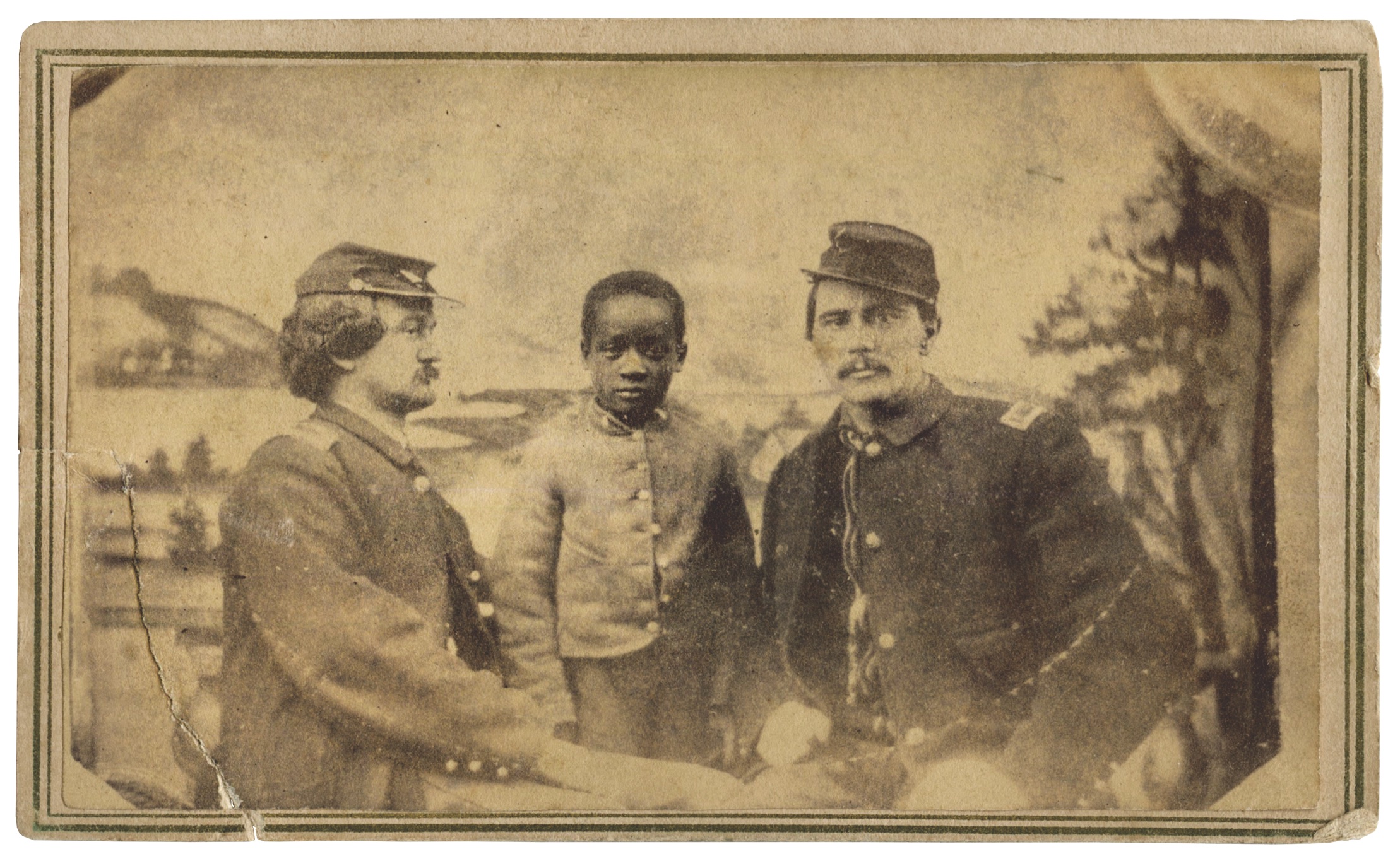 A refugee child whose life was forever altered by the war poses with two Union officers. (American Heritage Auctions, Adam Ochs Fleischer)