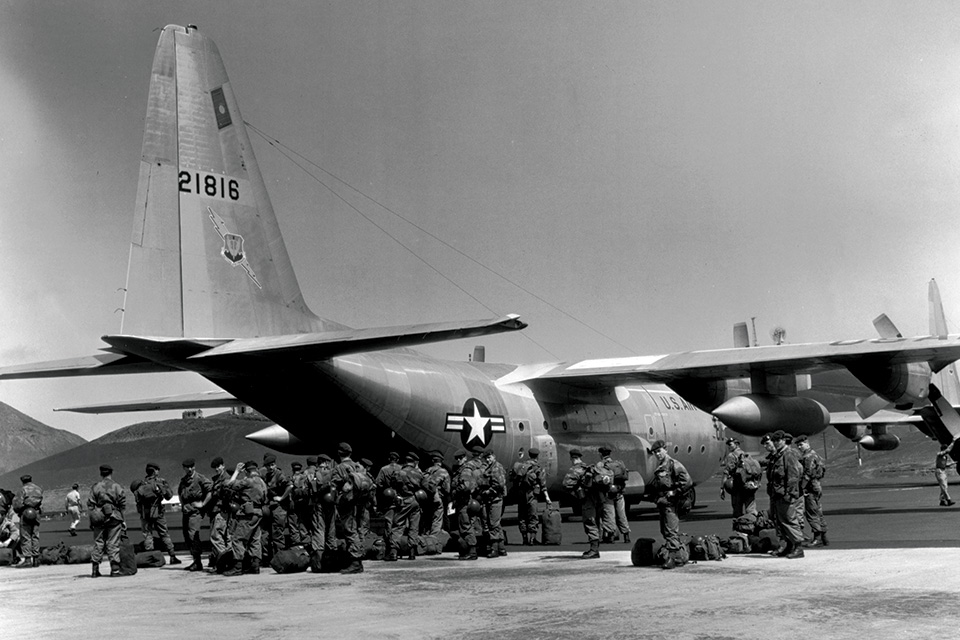 A U.S. Air Force C-130 from the 464th Troop Carrier Wing delivers Belgian paratroopers to free civilians in Stanleyville on November 24, 1964. (Photo12/Universal Images Group via Getty Images)
