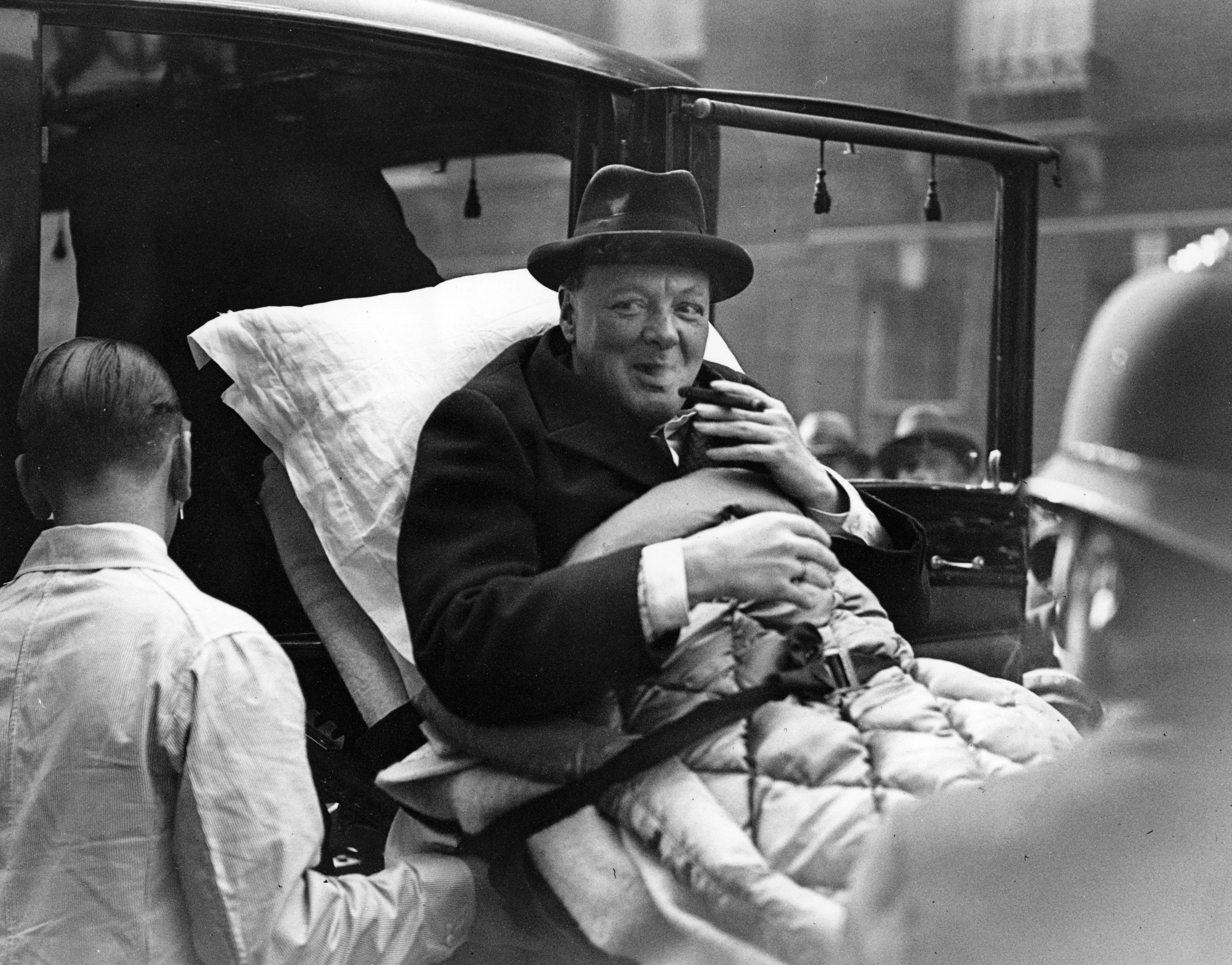 Winston Churchill being carried into his London home following his return from America where he was involved in a motor accident. (Keystone/Getty Images)