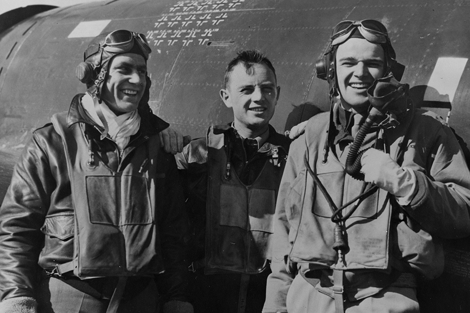 After returning from a March 6, 1944, raid on Berlin in which his 56th Fighter Group P-47 pilots claimed 30 German fighters, Lt. Col. Hubert “Hub” Zemke (center) congratulates 1st Lt. Robert Johnson (left) and Captain Walker Mahurin on their victories. (National Archives)