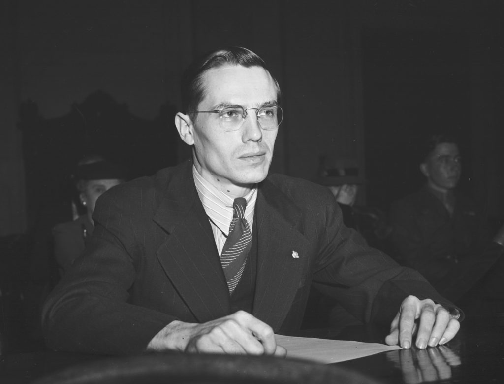 Private George E. Elliott Jr. (above), who had insisted on reporting the radar contacts, testifies at one of the 1945-46 Congressional hearings (below). (AP Photo)
