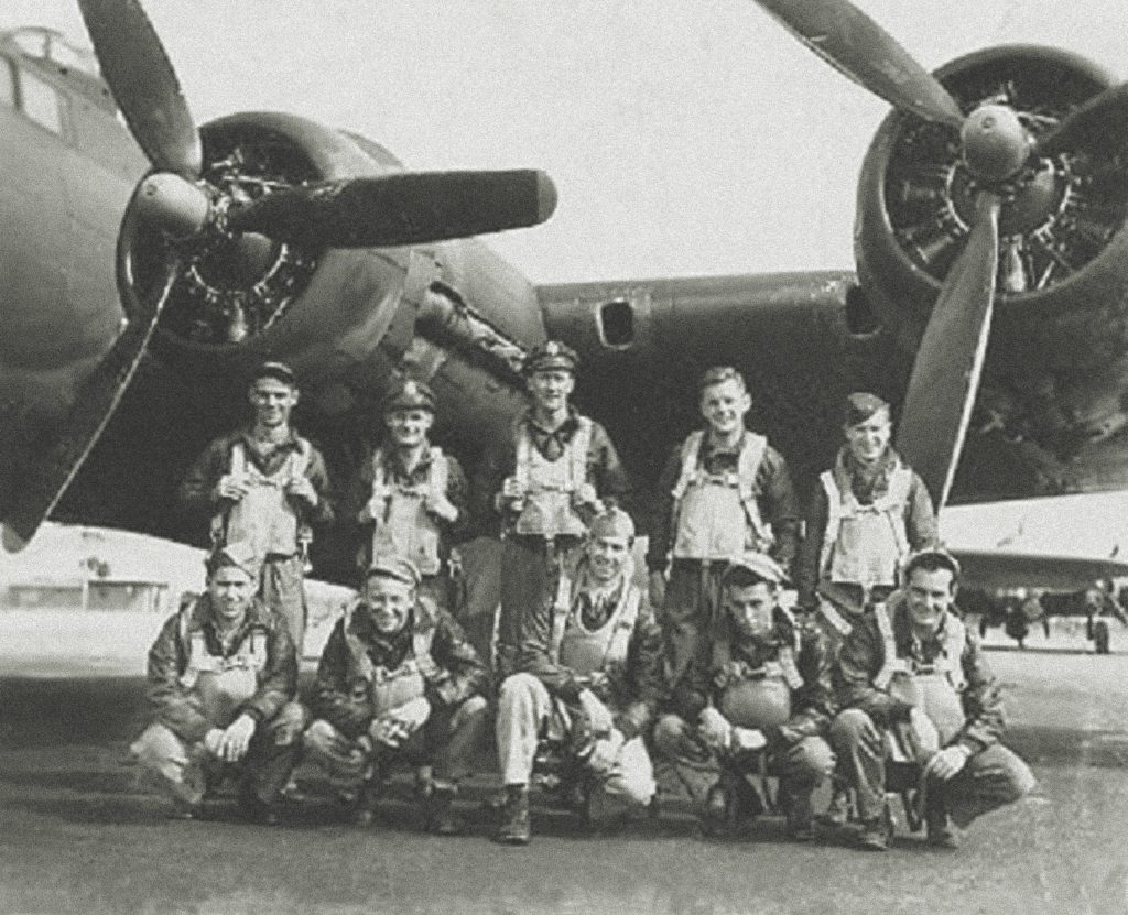 Pilot Bill Pozolo (top, back row center) gathers with his crew from an earlier mission; in the front row are James Martin, second from left; Tony Capone, second from right; and Leo Moser, far right. (95th Bomb Group Association)