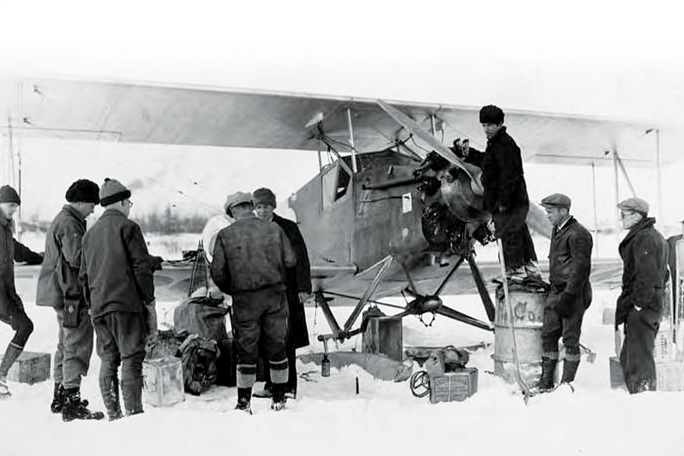 A Wien Alaska Airways Detroiter is fueled up from a 55-gallon oil drum. Fuel had to be hand-cranked out of the drums into the airplane’s tanks. (University of Alaska, Fairbanks)