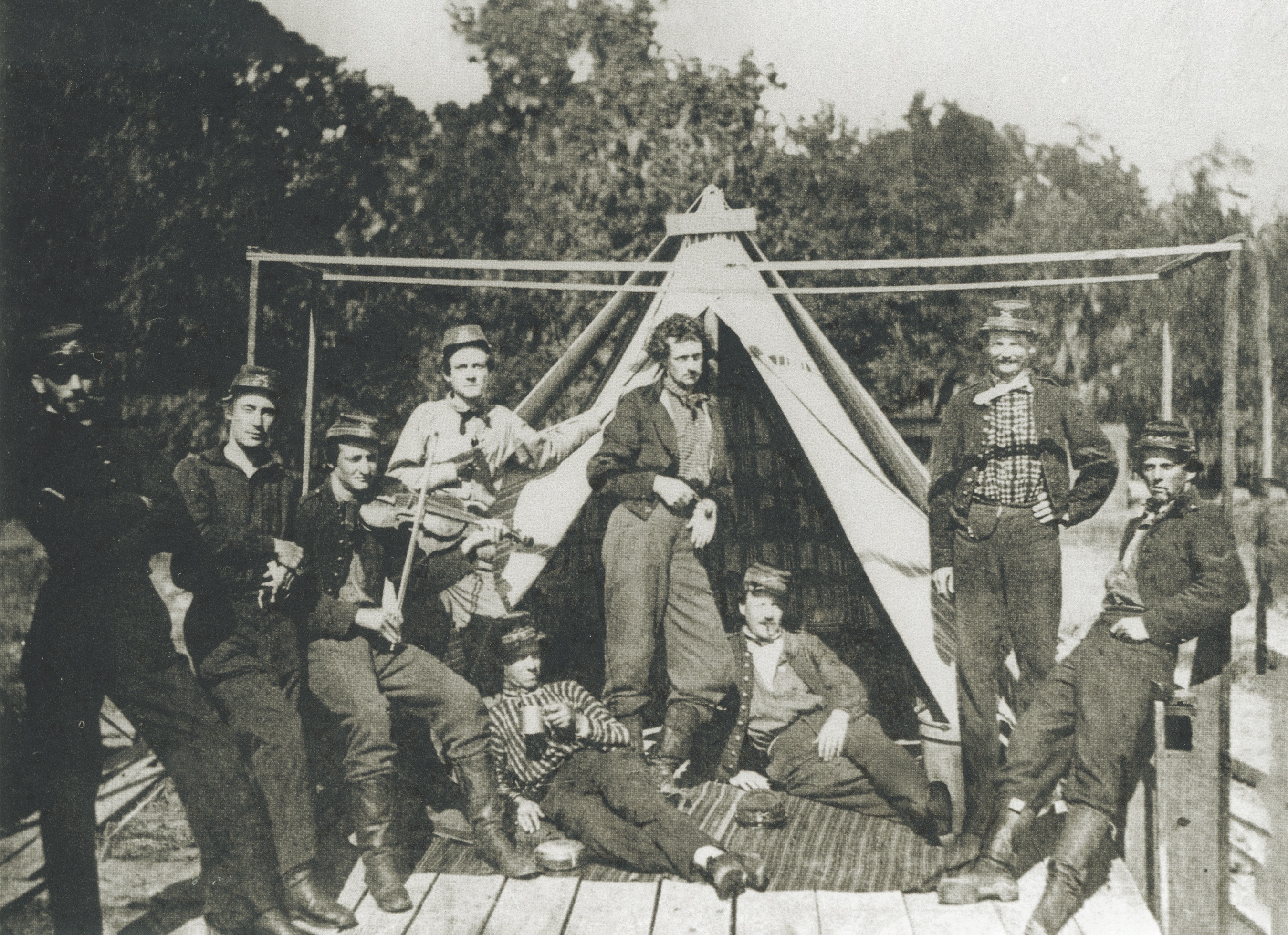 Washington Artillerymen relax in camp early in the war. A fiddle player alludes to the musical prowess of the unit, put on display during the Vicksburg Campaign. (USAHEC)