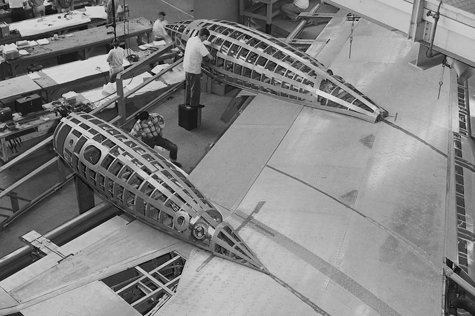 Anti-shock pods called Küchemann carrots or Whitcomb bodies cut down on wave drag at transonic speeds and helped give the 990 a speed edge. (San Diego Air & Space Museum)
