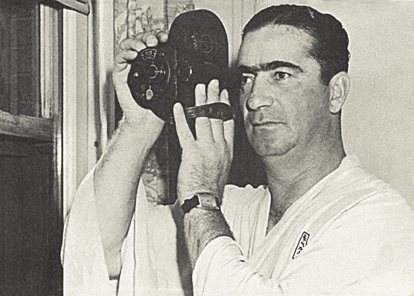 Berg with his 16mm Bell and Howell movie camera. (Arthur W. Diamond Law Library, Columbia University School of Law)