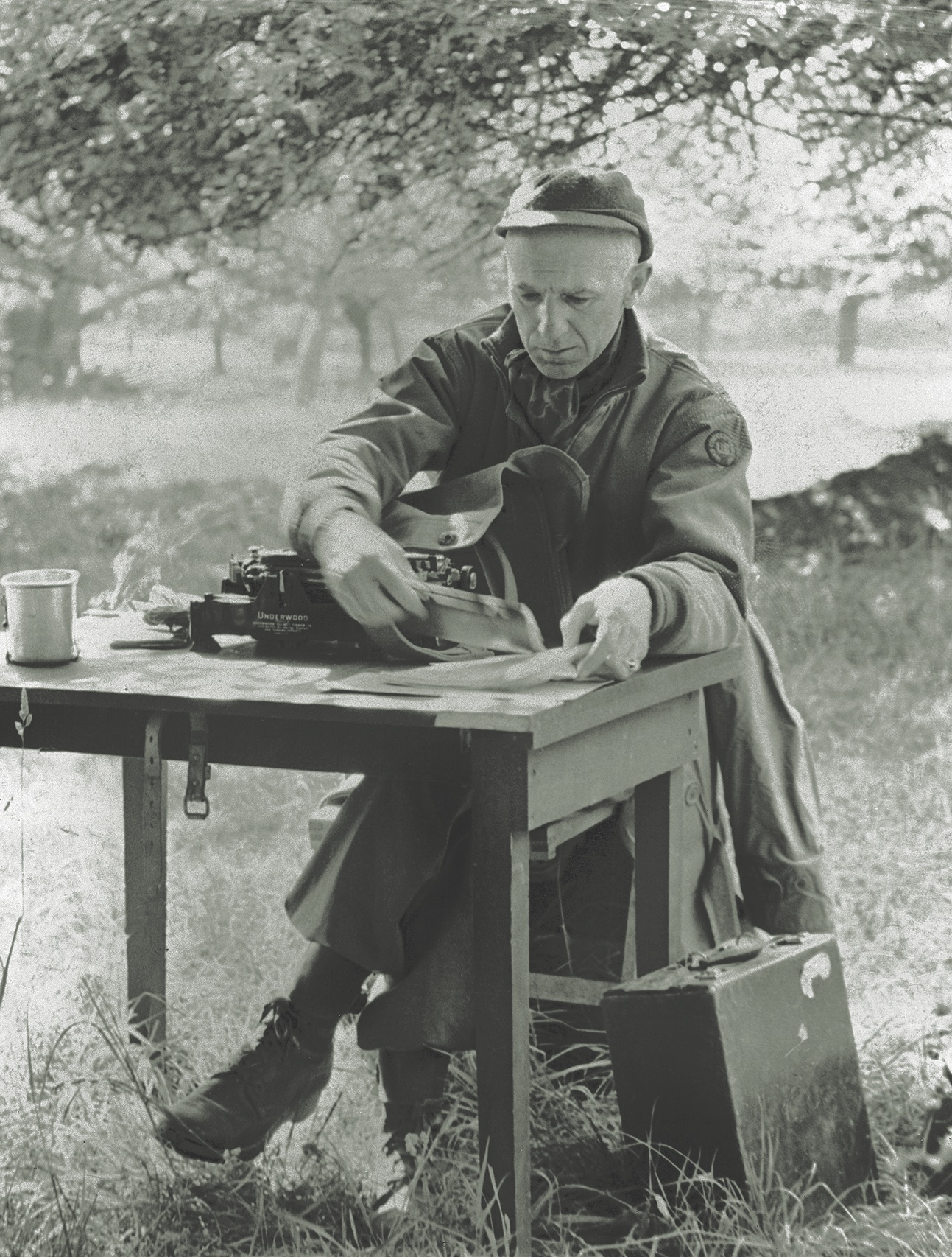 Pyle works at a desk in the field in Europe in 1944. (Bettmann/Getty Image)
