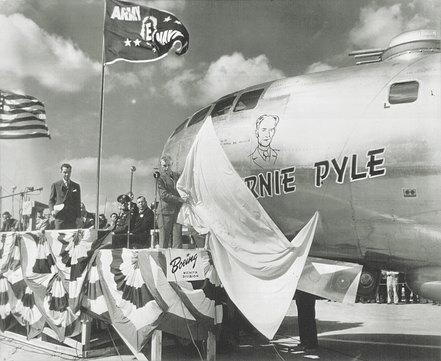 Pyle’s father unveils the Boeing B-29 Superfortress named for his son at a dedication ceremony in 1945. (U.S. Marine Corps History Division)