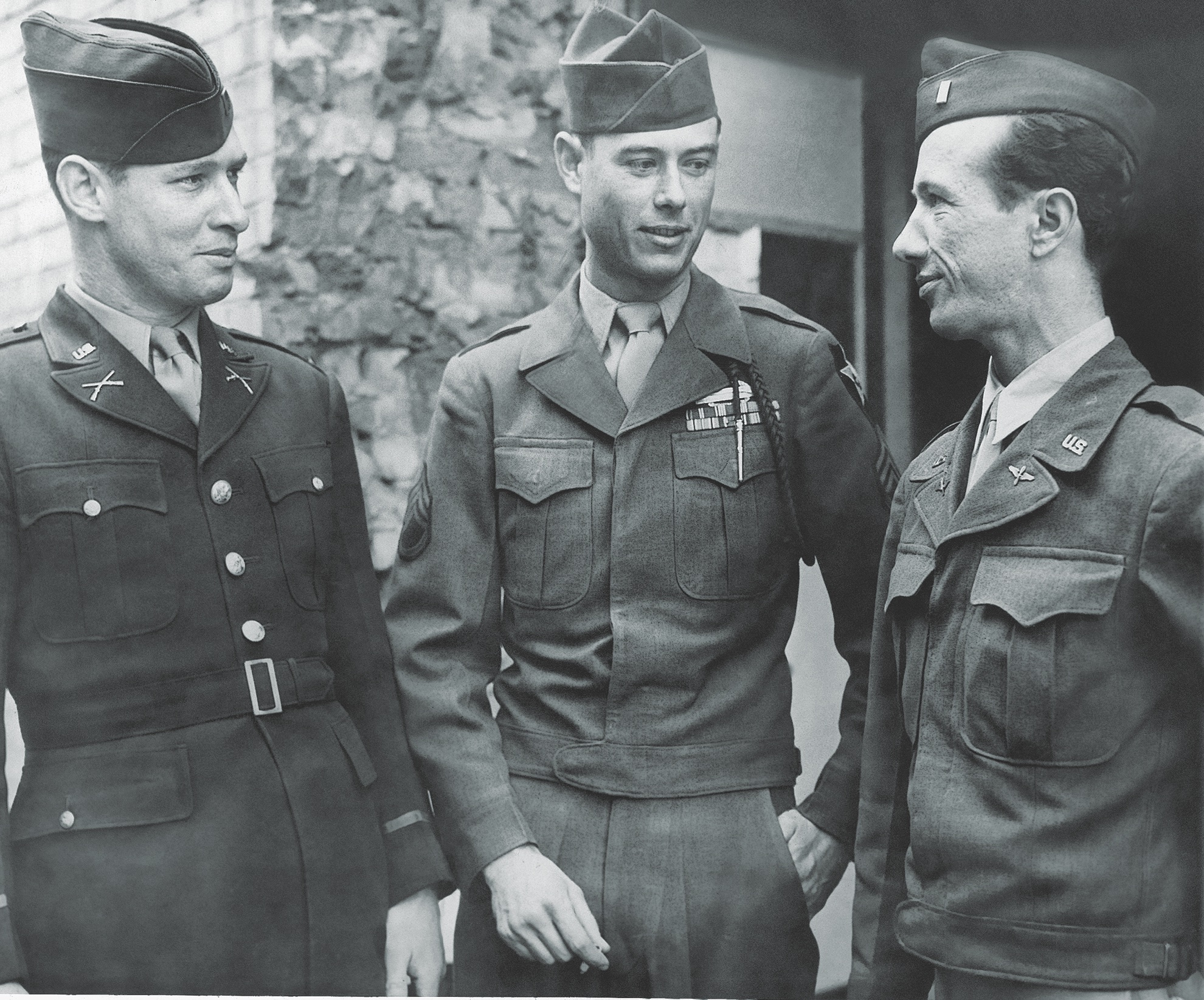 Presumably fearing retaliation, seven enlisted men confined at Lichfield refused to testify at the court-martial of a former guard, Staff Sergeant James M. Jones, shown here (center) with two members of his defense team. (Associated Press)