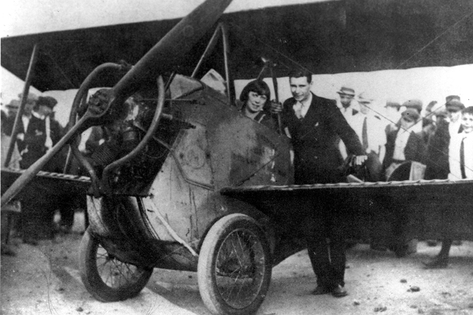 Redfern and his wife Gertrude pose with the biplane he built after high school. (Redfern Family Collection)