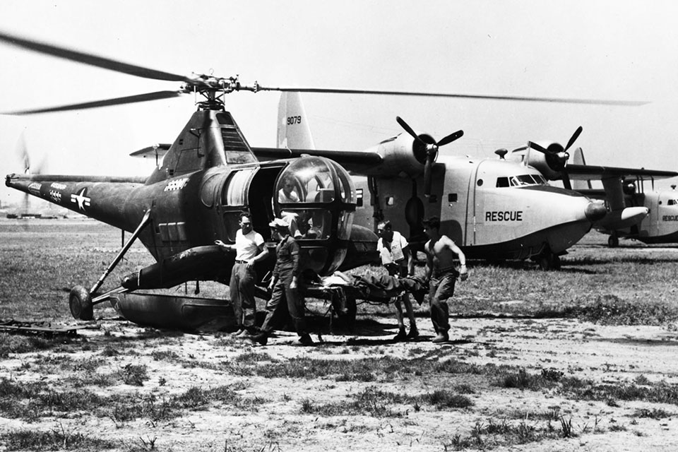 Grumman’s amphibious SA-16B Albatross, developed specifically for SAR missions, began service in the Korean War. Here, airmen in Korea transfer a patient from an Albatross to a Sikorsky H-5G helicopter. (U.S. Air Force)