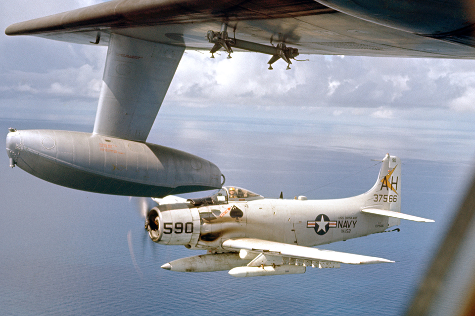 A Douglas A-1E escorts an Albatross off the Mekong Delta. (Courtesy of Dave Wendt)