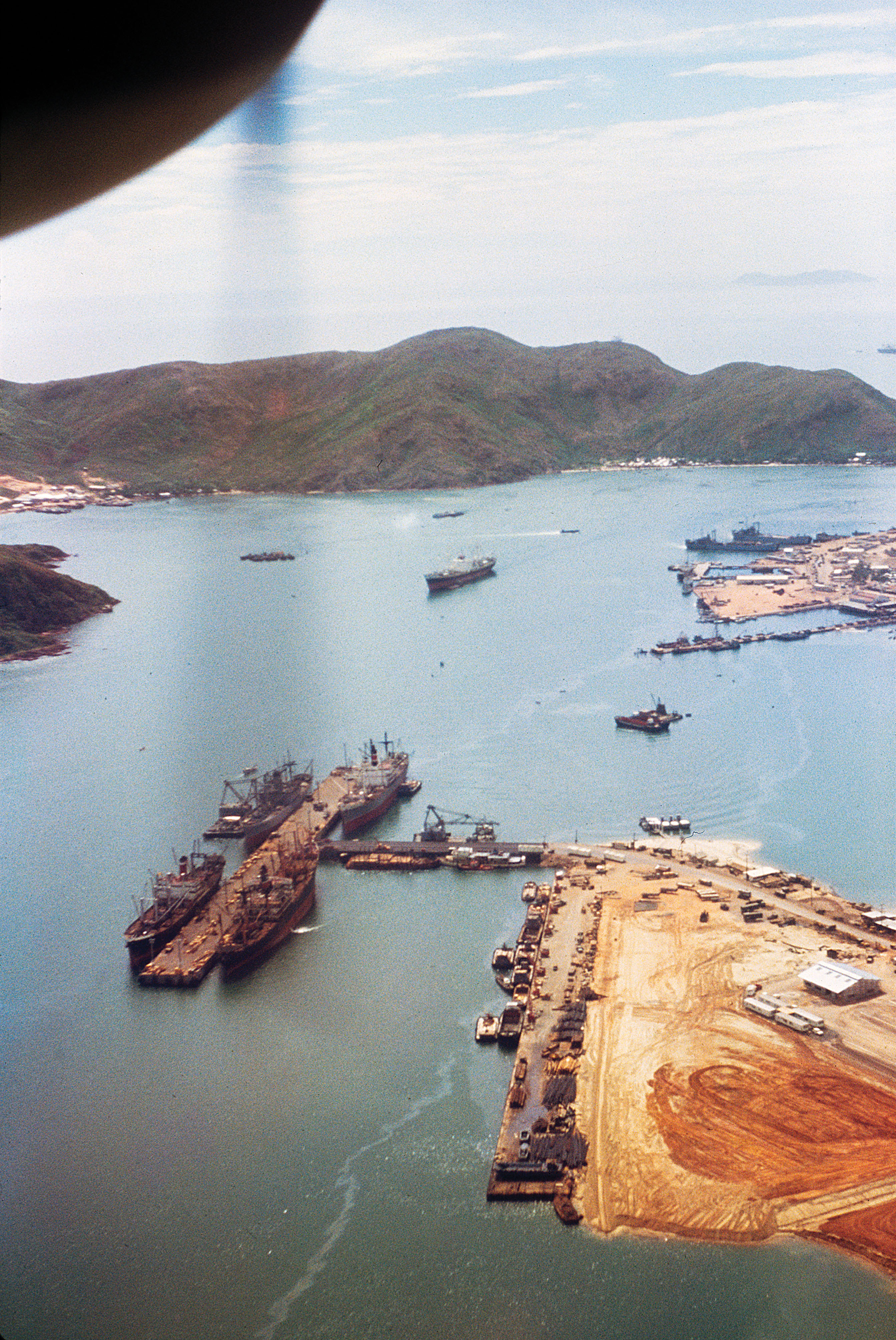 The harbor at Cam Ranh Bay c. 1967. The harbor was a major supply center for U.S. and allied troops. Heavy damage there would have severely hindered military operations. / AWM P02060.07