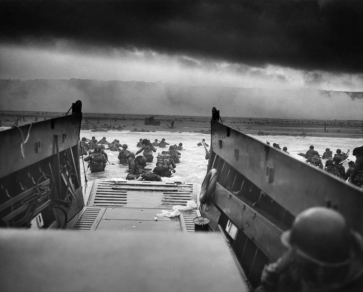 Into the Jaws of Death: Troops from the U.S. 1st Infantry Division landing on Omaha Beach, June 6, 1944. (Robert F. Sargent/National Archives)