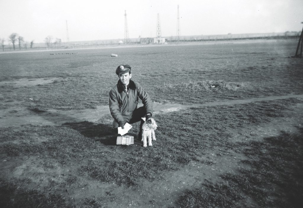 Lamb at Duxford air base with his squadron’s beloved mascot, Brussels. (Courtesy of Huie Lamb)