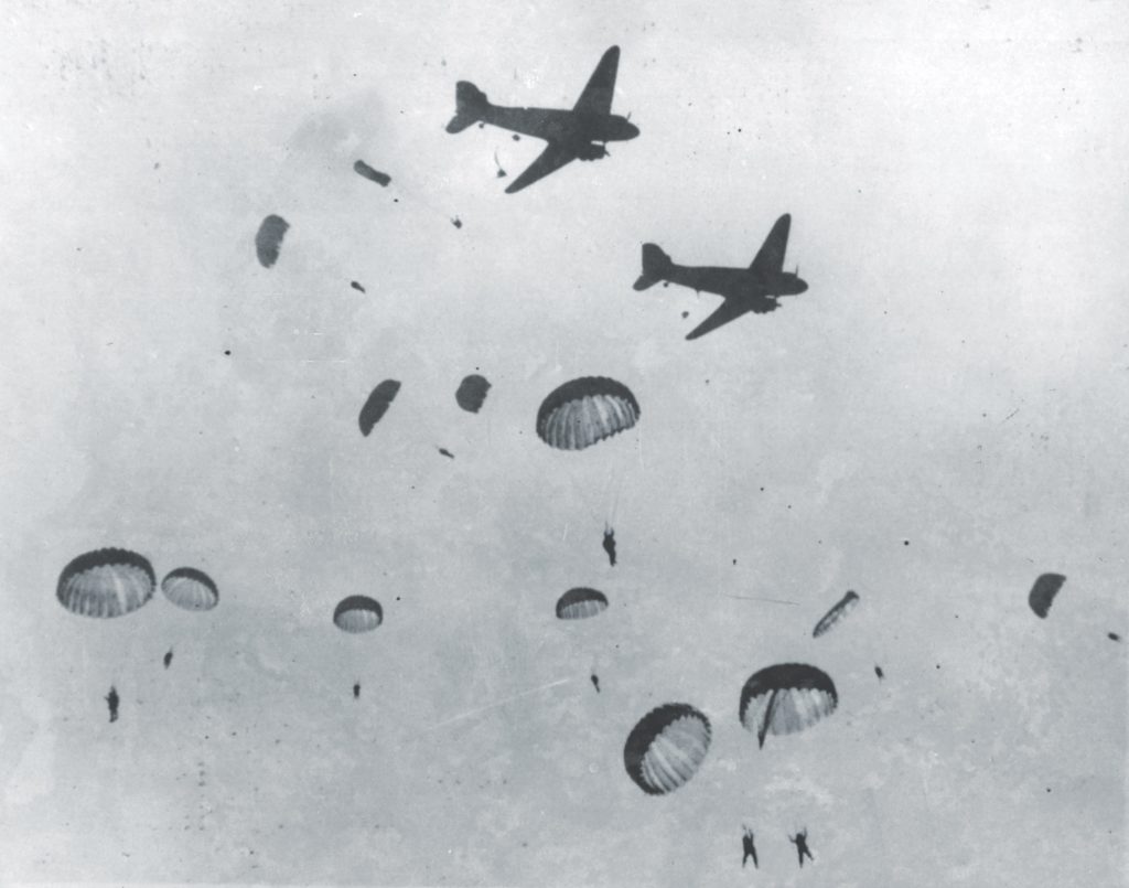 Paratroopers jump over Sicily; Ridgway’s concern proved well-justified as antiaircraft fire pelted the 504th’s C-47s. Those who escaped the planes faced further attacks on their descent and on the ground. (Keystone/Getty Images)