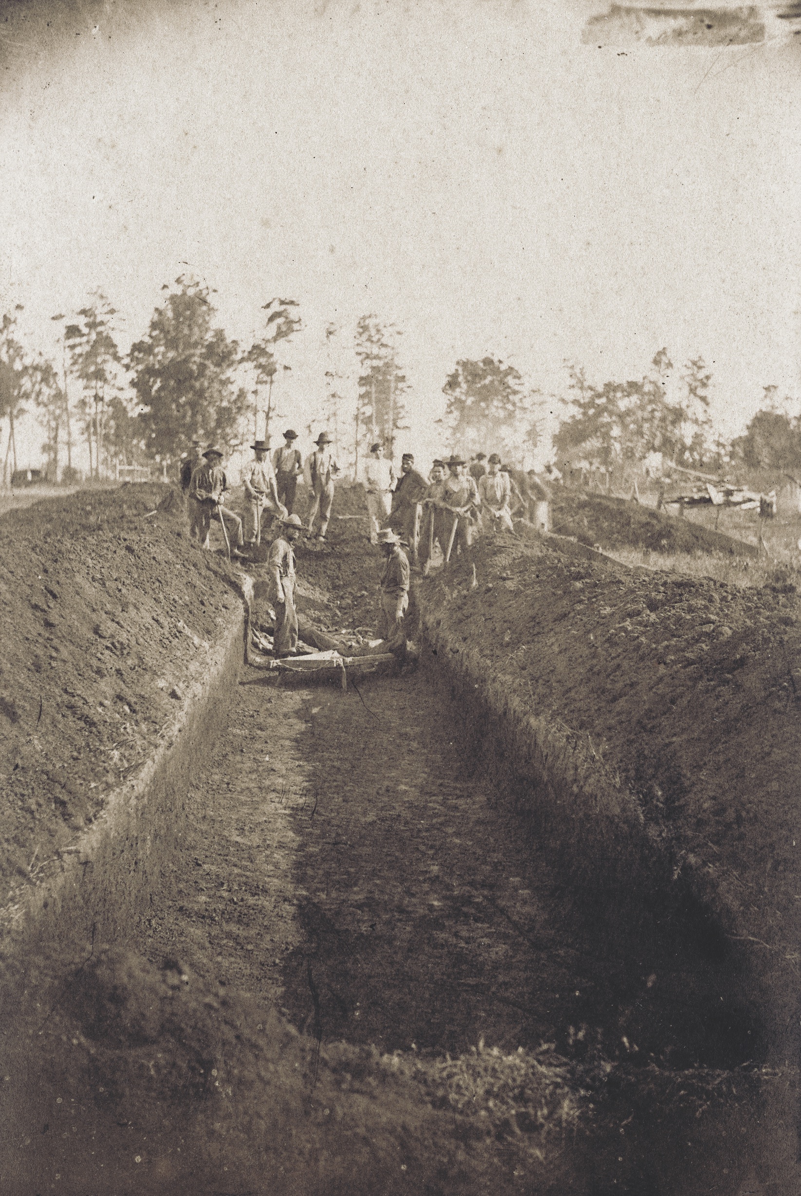 Union prisoners of war bury some of their own in a trench at Andersonville in 1864. (Library of Congress)