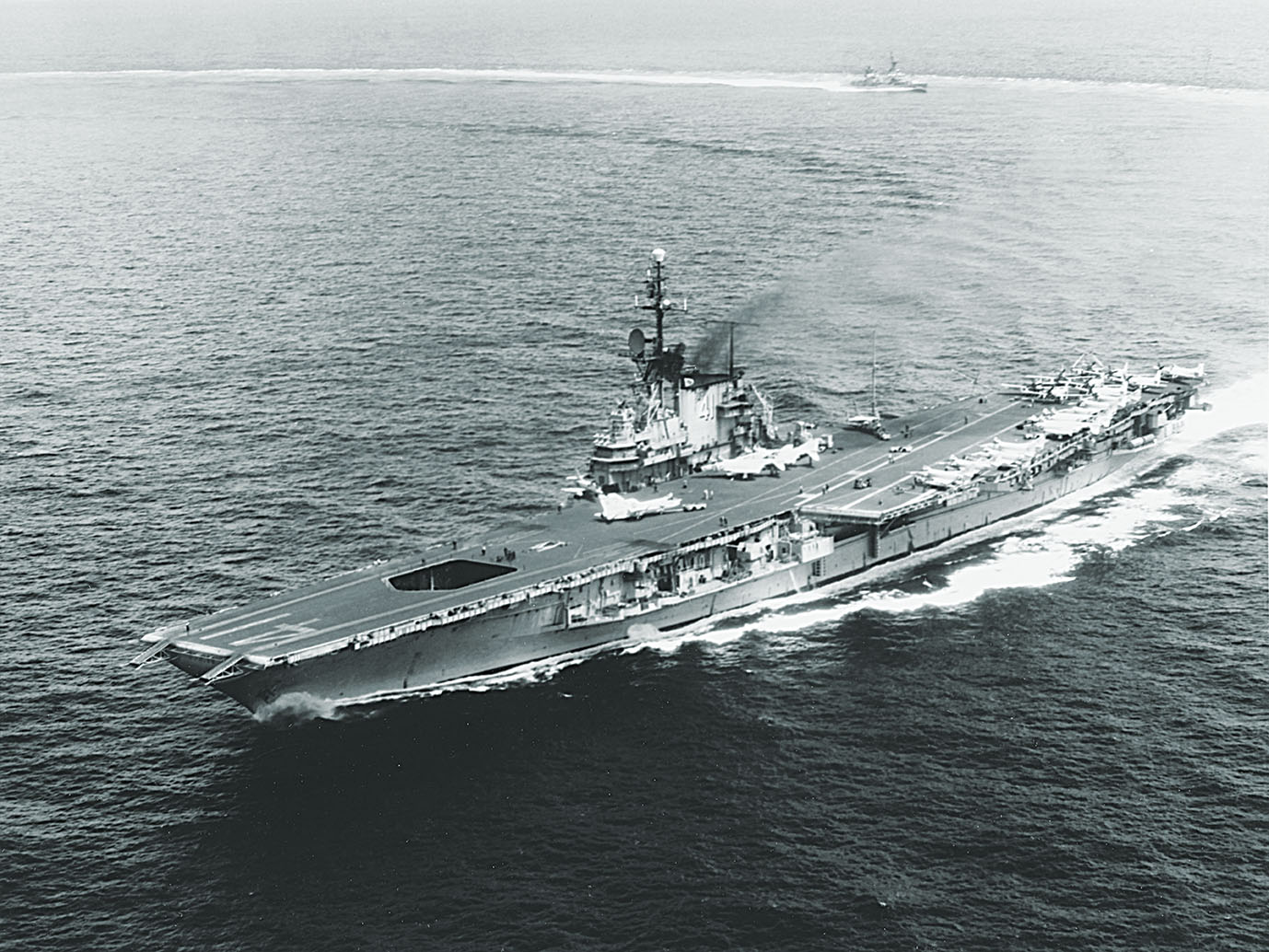 Operating in the South China Sea in October 1965, Midway displays the added angled deck that extended its usefulness. / Naval History and Heritage Command
