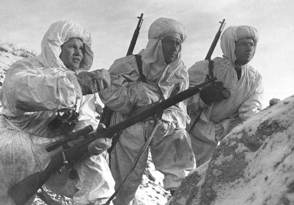 Vasily Zaitsev (left) with his Mosin–Nagant M1891/30 accompanied by other Soviet snipers during the Battle of Stalingrad in December 1942. Zaitsev’s rifle is equipped with a 3.87×30 PE(M) telescopic sight. Both items will feature in the new sniper exhibit. / Public domain