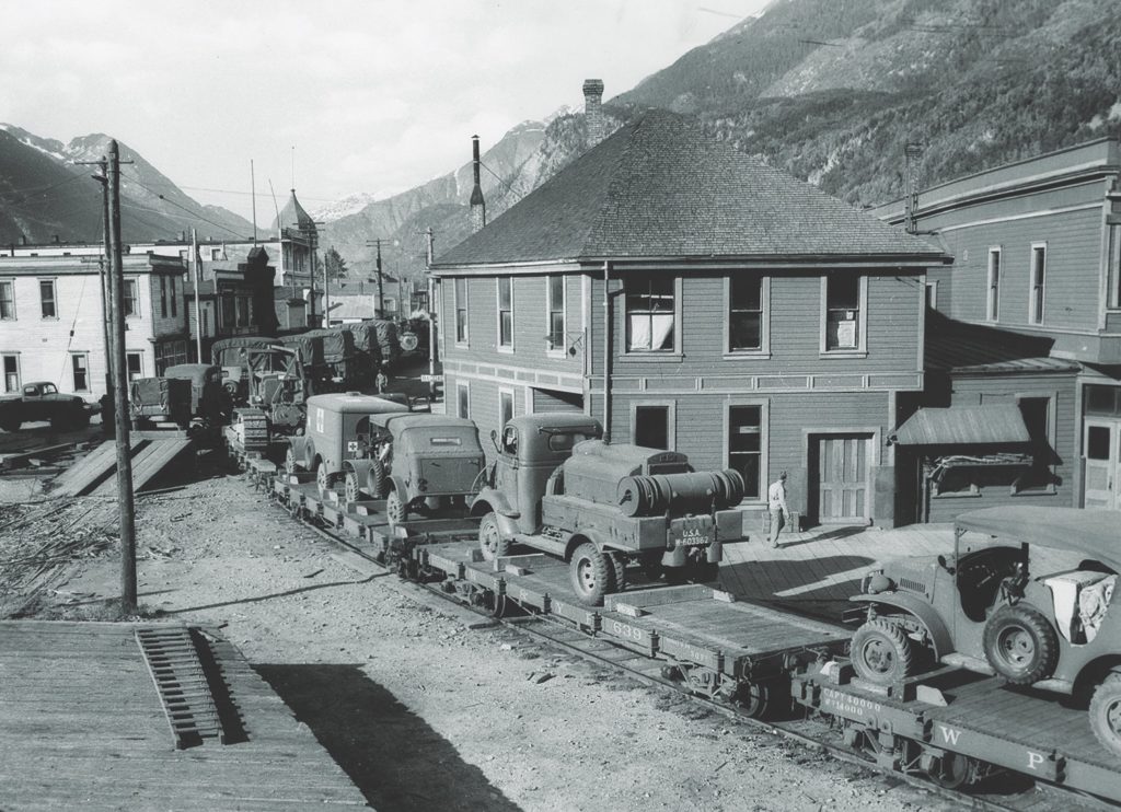 A trainload of U.S. Army freight wends its way up the middle of State Street in Skagway. After the winter storms passed, the army’s railroaders finally met, and exceeded, their tonnage goals. (National Archives)