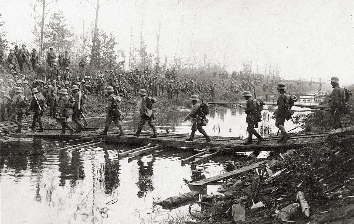 German infantrymen cross a canal on May 27, the first day of the battle. / Imperial War Museums
