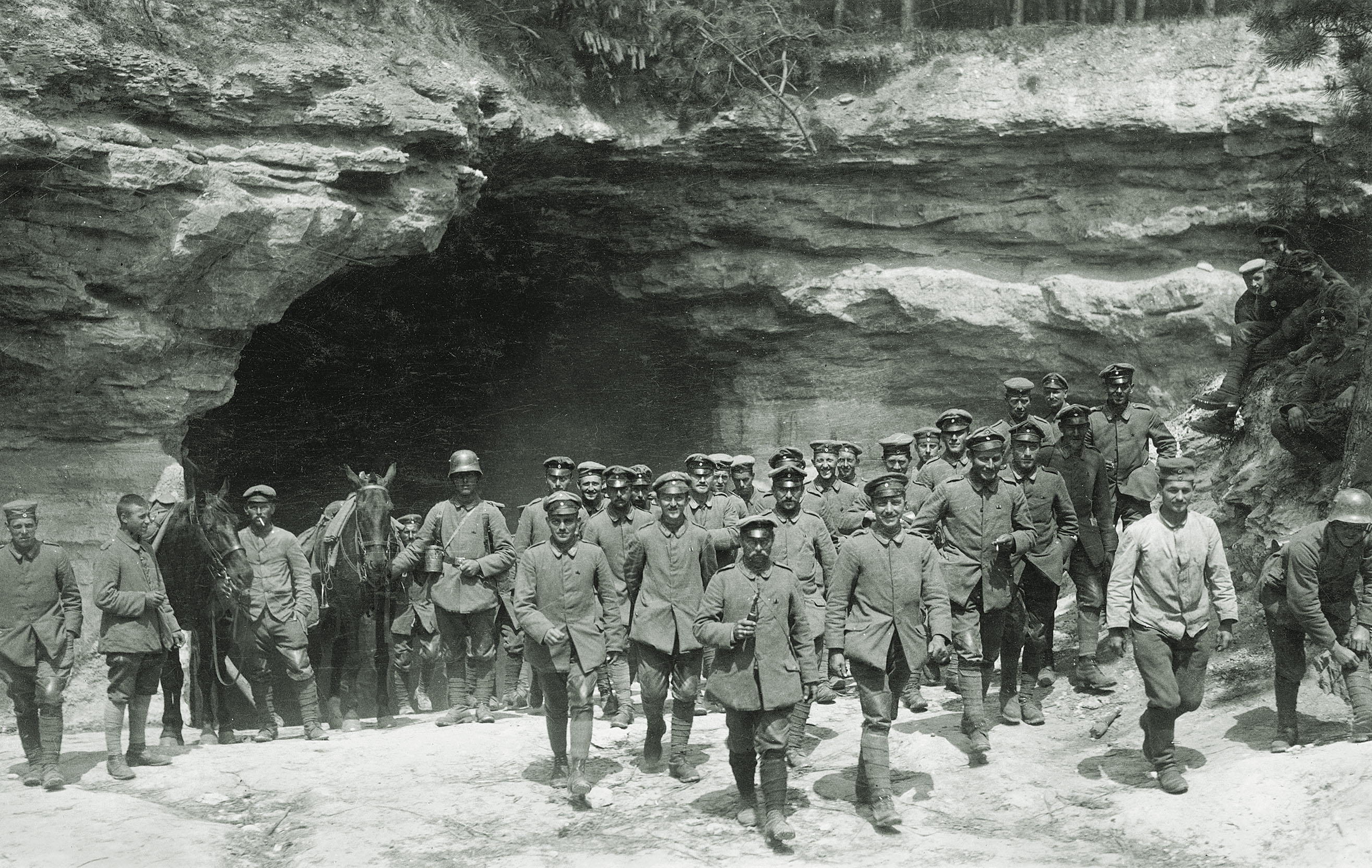 German soldiers pose outside a supply and accommodation cave captured from French forces during the June attacks toward Reims / Imperial War Museums