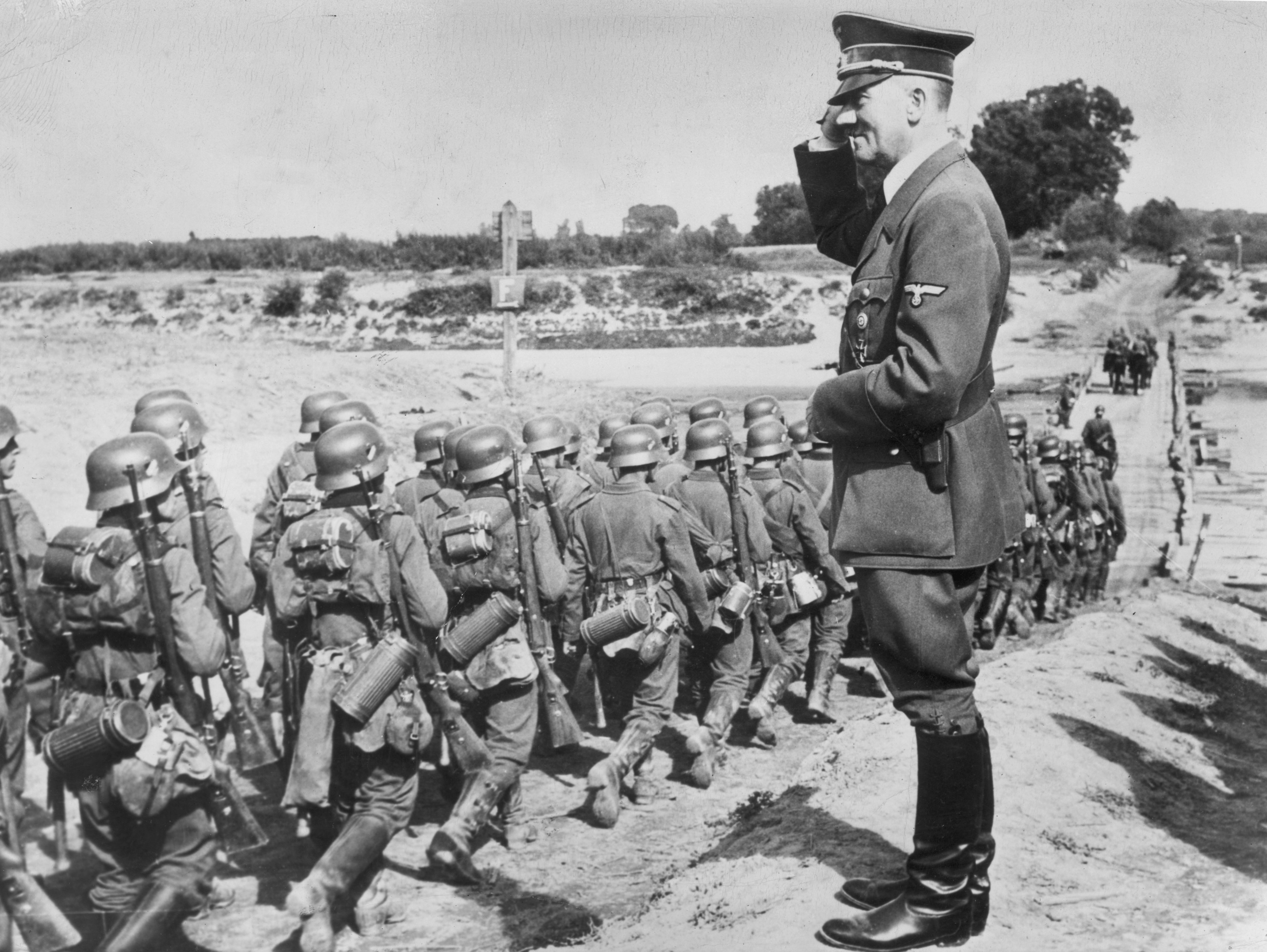 Adolf Hitler salutes parading troops of the German Wehrmacht near Jarolaw, Poland, in 1939. (Getty Images)