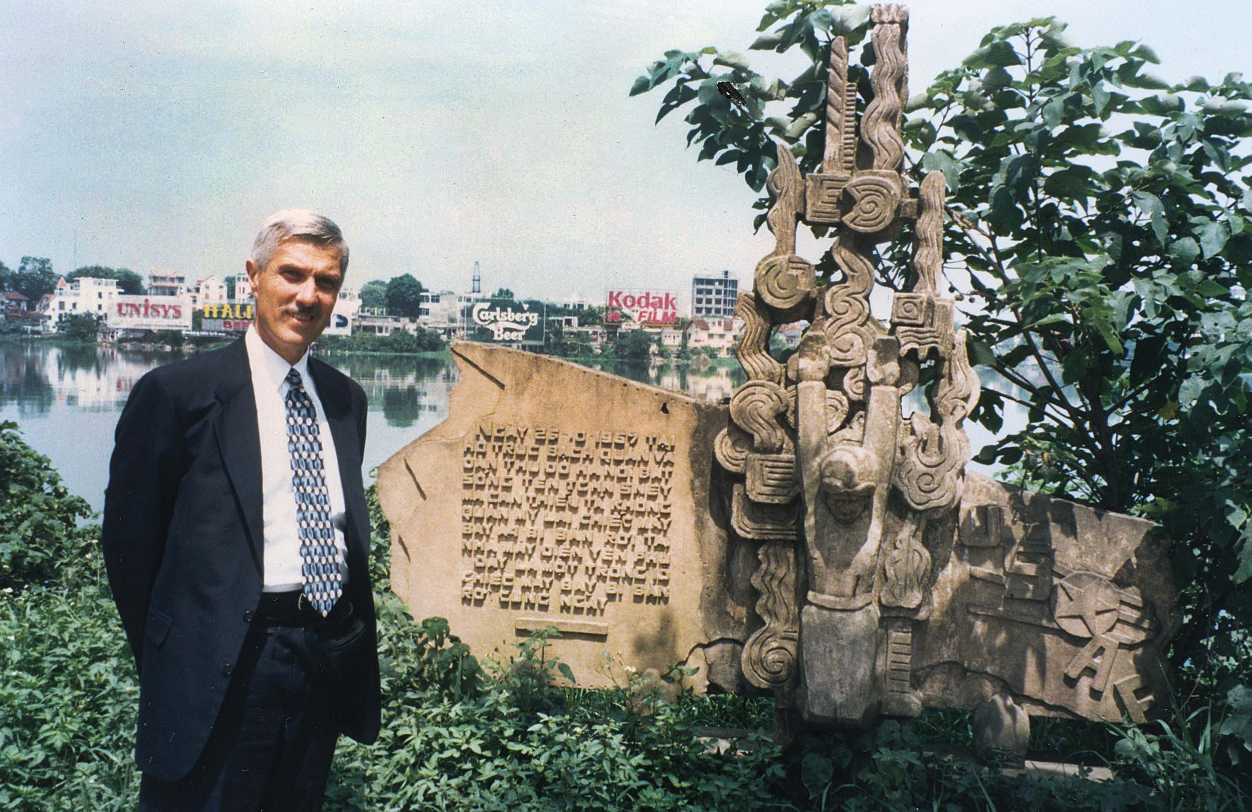 Lutz stands beside a statue of shackled Navy pilot John McCain on the bank of Hanoi’s Truc Bach Lake, commemorating the spot where the future U.S. senator’s jet crashed after being shot down in 1967. / Courtesy photo