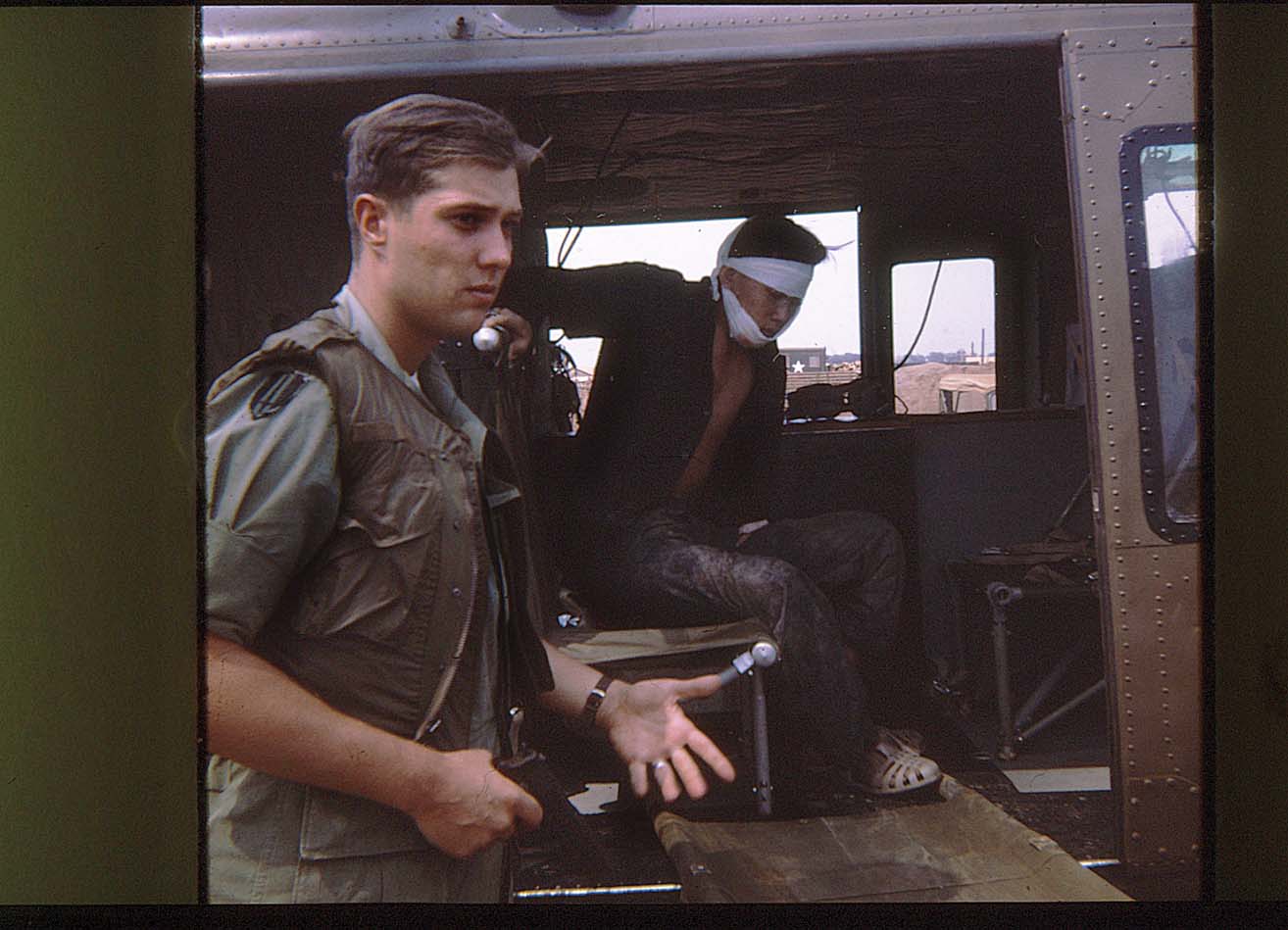 Lutz escorts a captured Viet Cong from a helicopter at Xuan Loc in 1969, when he served as an adviser to the intelligence staff of South Vietnam’s 18th Infantry Division. / Courtesy photo