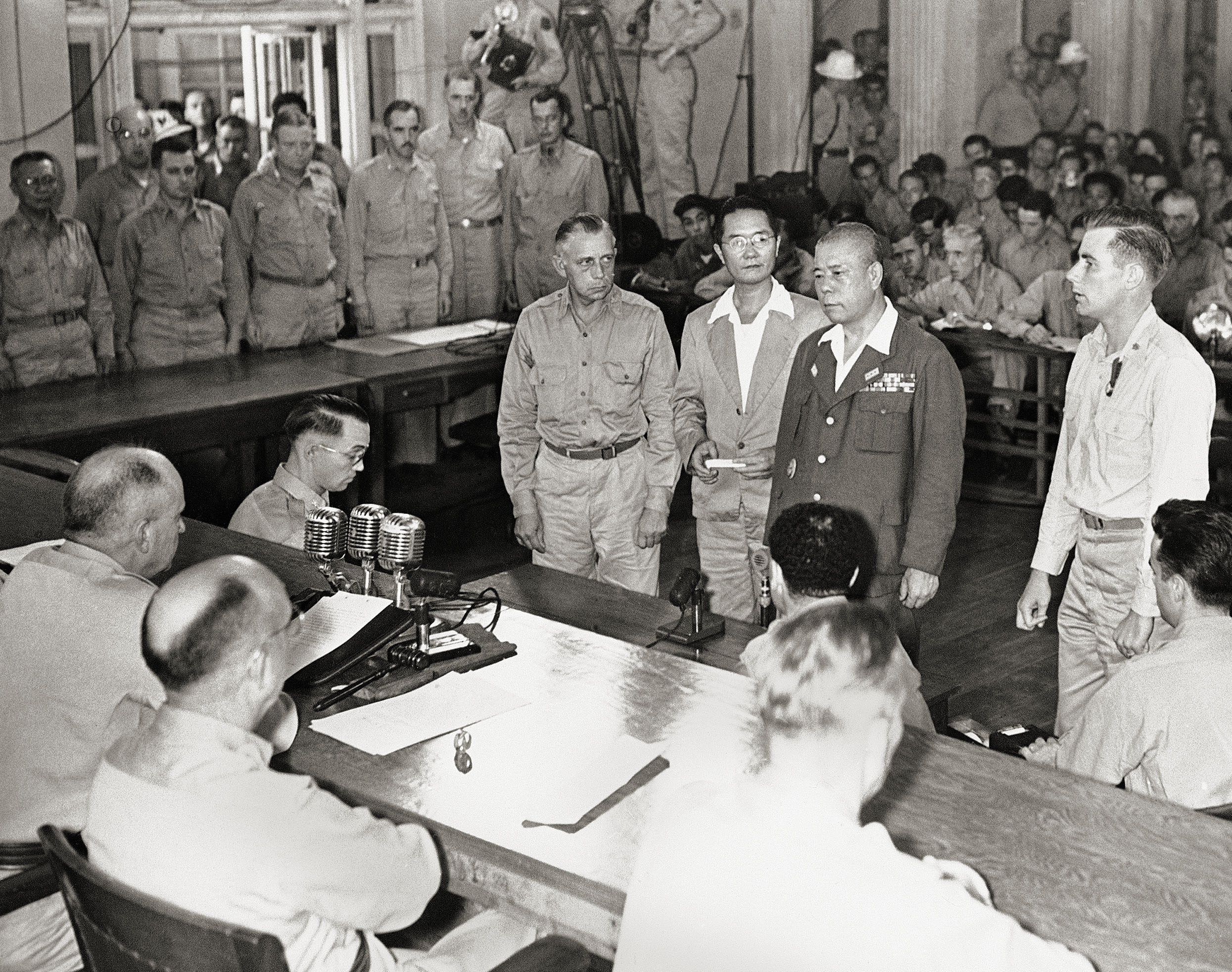 Pratt (at far right) stands beside Yamashita on Dec. 7, 1945, as the Japanese general is sentenced to death for atrocities committed by troops under his command. / AP
