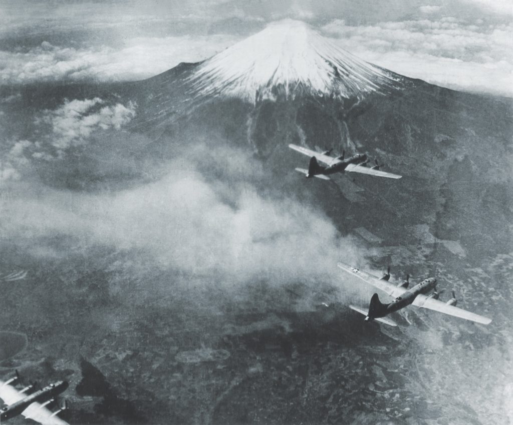 B-29 Superfortresses fly past Japan’s Mount Fuji. Japanese air defenses forced four B-29s down in Russia; their crews joined the cadre of American airmen held in temporary Soviet custody until additional “escapes” could be set in motion. (National Archives)