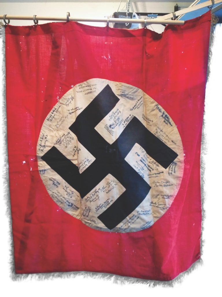 Soldiers’ signatures transform a flag that may have once appeared in a Nazi parade into a very different and meaningful artifact. (Courtesy of Jean Leslie)