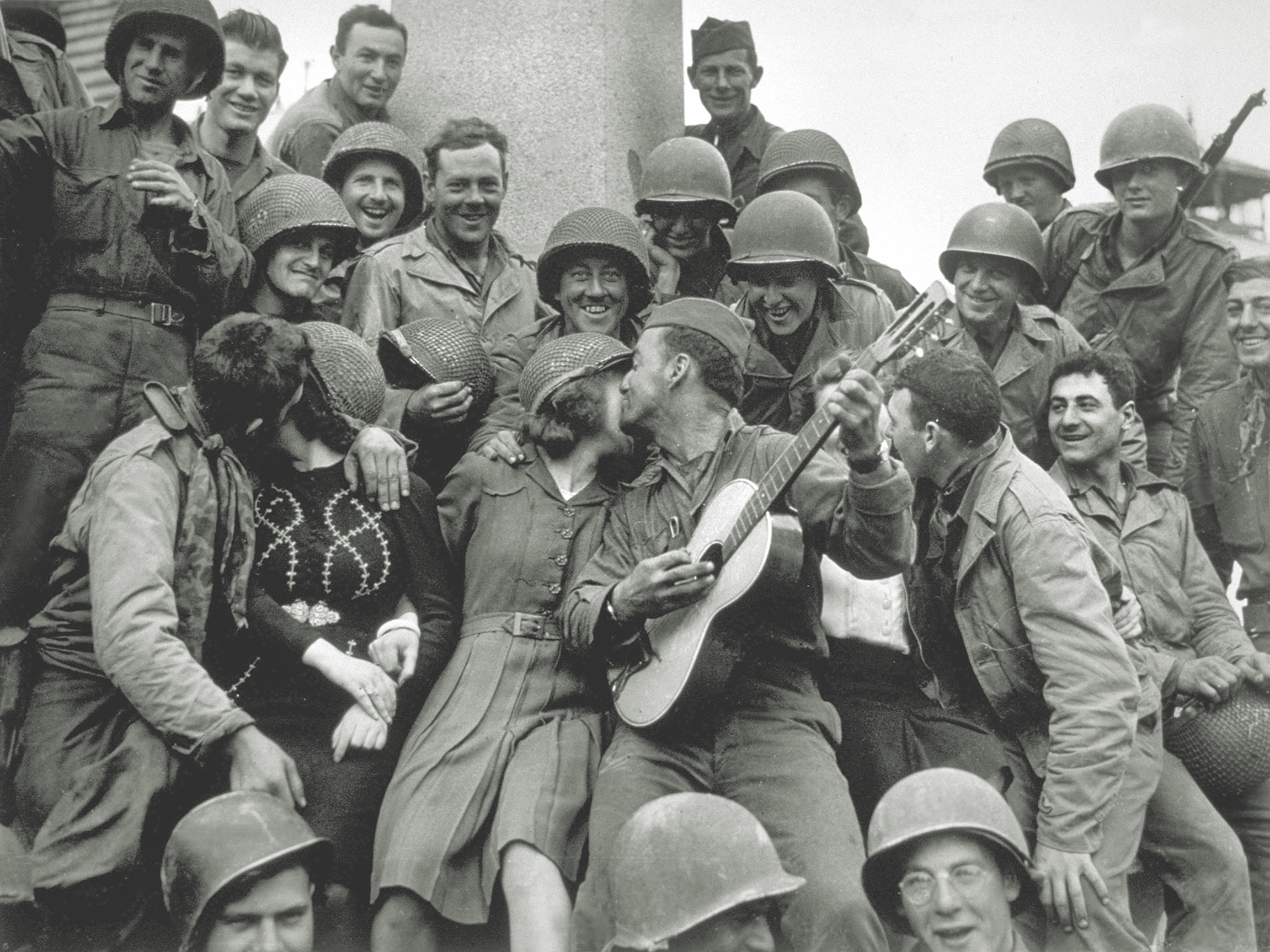 American GIs receive a warm welcome from the locals after liberating Cherbourg. (Keystone/Getty Images)