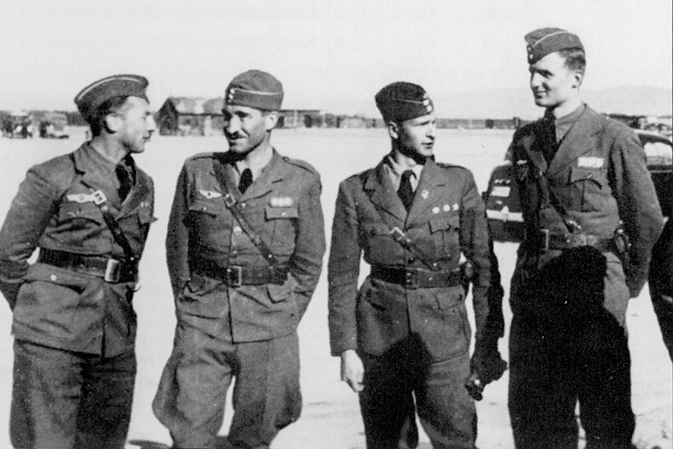 Condor Legion fighter squadron leaders (from left) Wolfgang Schellmann, Adolf Galland, Joachim Schlichting and Eberhardt d’Elsa chat in April 1938. (HistoryNet Archives)