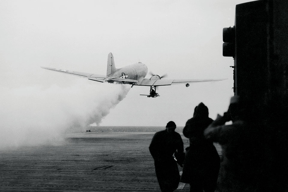 An R4D carrying Admiral Byrd and his men makes a jet-assisted takeoff from the carrier Philippine Sea and heads to Antarctica on January 29, 1947. (Popperfoto via Getty Images)