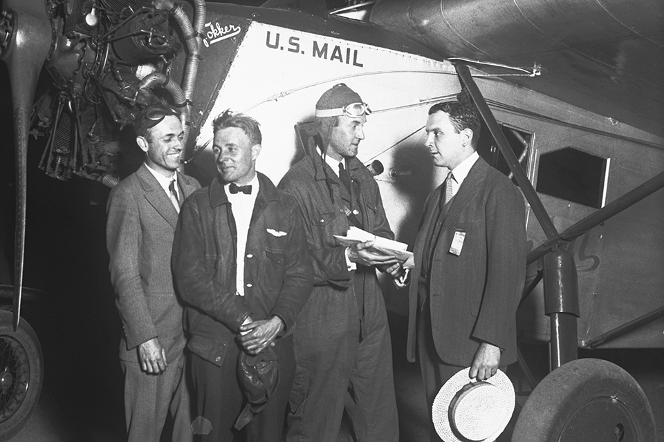Juan Trippe (right) congratulates three Colonial Air Transport pilots following their first airmail delivery between Boston and New York in 1926. (Bettmann/Getty Images)