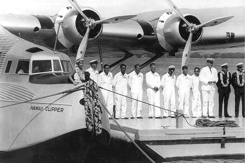 On May 3, 1936, a Pan Am crew participates in the christening ceremony for Hawaii Clipper, one of three big four-engine Martin M-130s built for the airline. (Pan Am Historical Foundation)