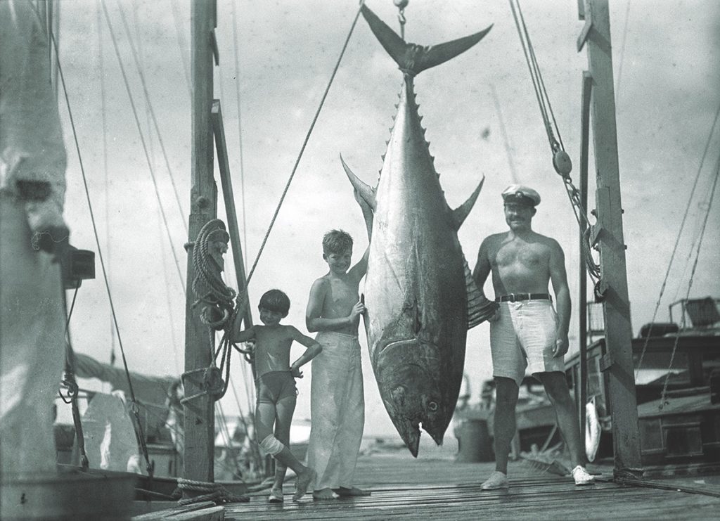 Hemingway, a more successful fisherman than naval operative, poses with his sons and a vanquished tuna. (John F. Kennedy Presidential Library and Museum/Ernest Hemingway Collection)