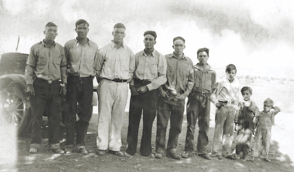 Lincoln Bundy (center) stands with his father, James (far left), and brothers at their rural Arizona home in the mid-1930s. With the outbreak of war, Bundy decided to enlist with the U.S. Army Air Forces. (Sasha Nielson)