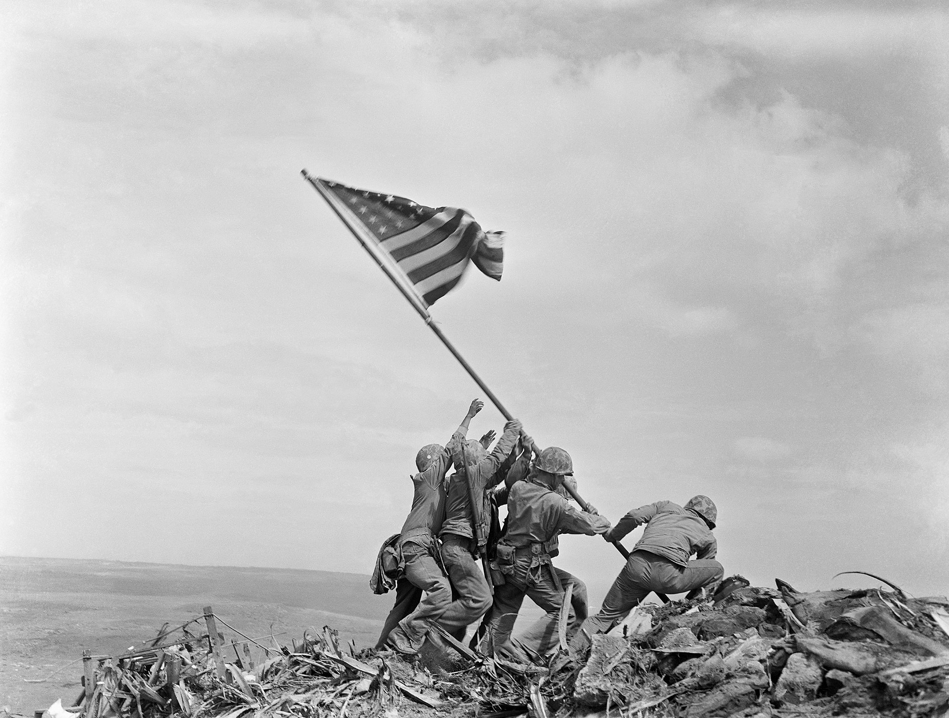 U.S. Marines raise the flag on Mount Suribachi.