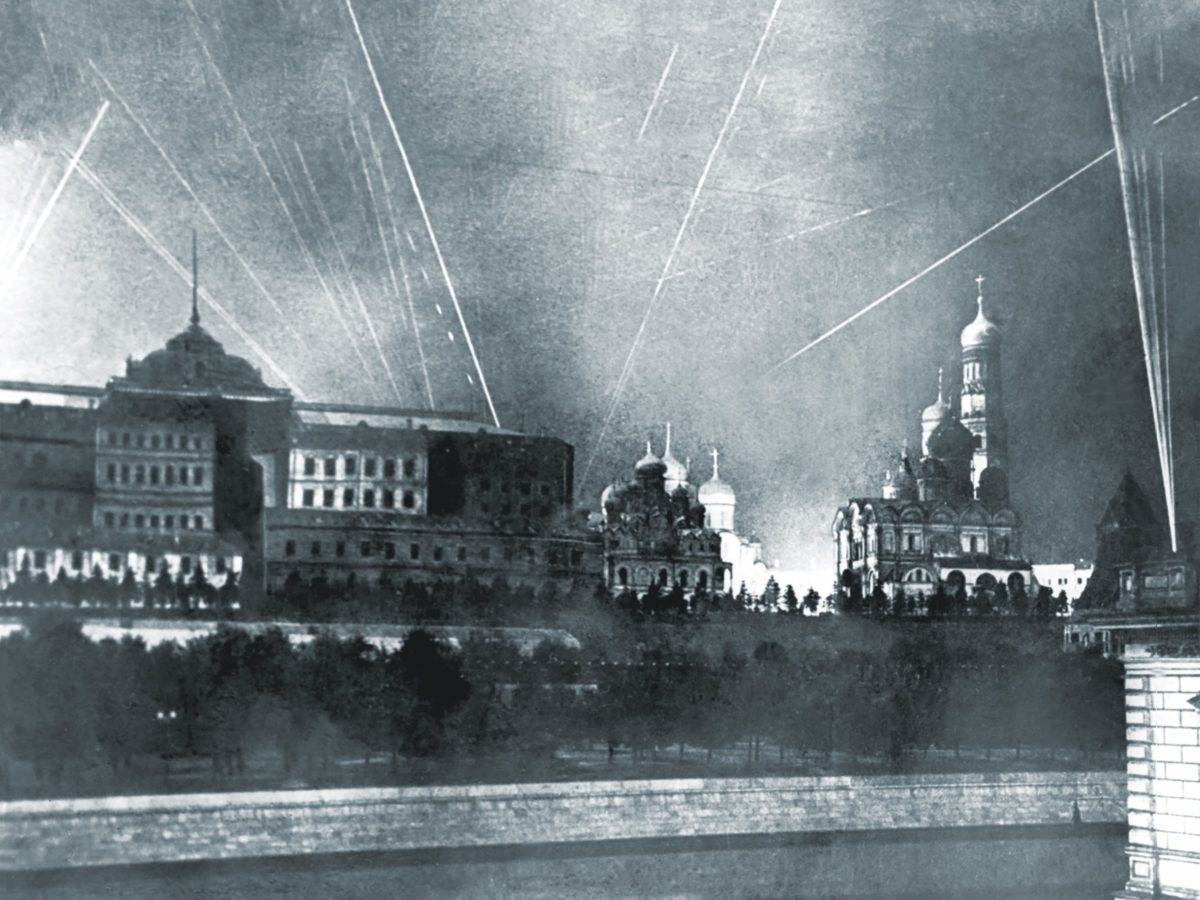 Soviet antiaircraft fire and searchlights punctuate the night sky over Moscow. Fear built below, leading to the October 16, 1941, day of the “Great Panic.” (Naum Granovsky/TASS via Getty Images)